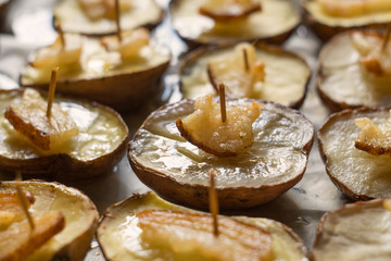 Potato halves baked with lard slices