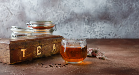 Glass cup of hot tea