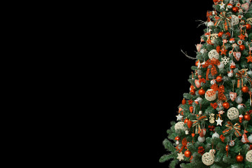 Half of christmas tree isolated on black background, decorated with vintage ornaments; ratan balls, burlap and tartan ribbons, wooden snowflakes, red berries and balls, red white jingle bells