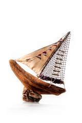Fototapeta premium Sailboat or fishing boat made of wood as nautical decoration on white background
