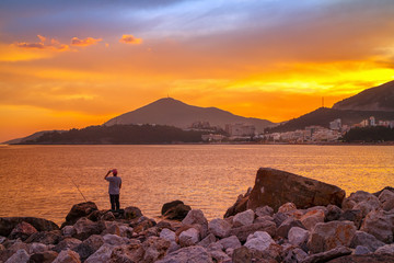 Colorful sunset on Adriatic sea,near the Budva city in Montenegro, gorgeous seascape and nature landscape