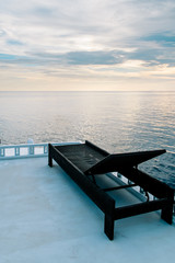 Fototapeta na wymiar Sunbed on the roof of a boat in the Indian ocean, Maldives. Relax and peaceful landscape