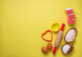 Ingredients for baking  on yellow background