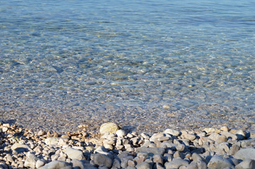 Fototapeta na wymiar Sea water and pebbles