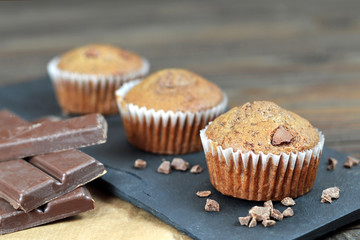 Chocolate muffins and broken pieces of chocolate
