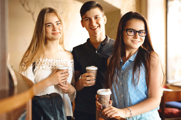Group of friends enjoying in cafe together.