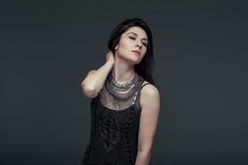 Fototapeta premium Portrait brunette attractive woman, accent on arms and face expr