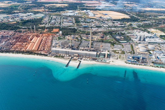 aerial view of large industrial area on coastline