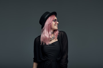 Portrait of fashionable girl with pink hair