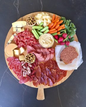 Appetizers on a vintage French wood board