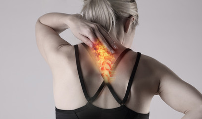Woman suffering from back pain . Sports exercising injury.