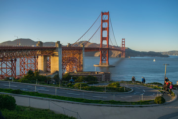 Fototapeta na wymiar Golden gate bridge at sunset from San Fransisco side. pedestrian path