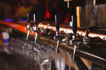 Fototapeta na wymiar bar counter with taps for draft beer