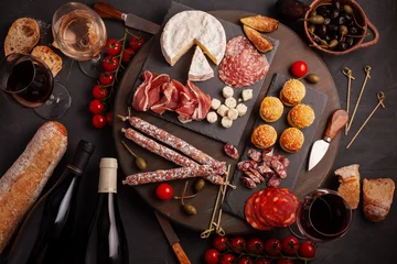 Printed roller blinds Buffet, Bar Appetizers table with differents antipasti, cheese, charcuterie, snacks and wine. Mini burgers, sausage, ham, tapas, olives, cheese and baguette over grey concrete background. Top view, flat lay