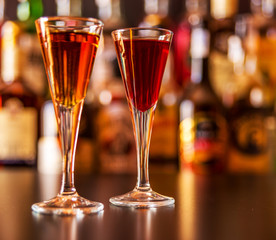 refreshing liqueur in a tall glass, alcoholic drink prepared by the bartender