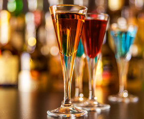refreshing liqueur in a tall glass, alcoholic drink prepared by the bartender