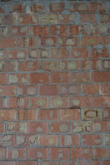 Red clay bricks with cement and brickwork of red, orange, yellow with gray and relief stripes