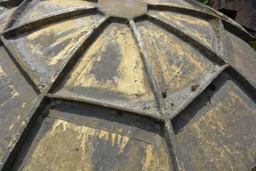 Construction structure with veins and withered paint, gray and yellow construction frame lid