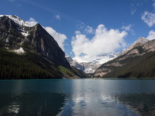 Fototapeta na wymiar Blue waters of Lake Louise in summer, Banff National Park, Alberta, Canada
