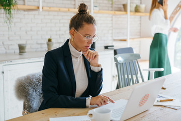 Businesswoman working at office.