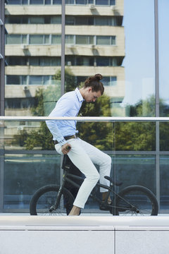 Young Businessman with a bike