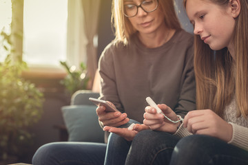 Periods. Menstrual cycle. Mother explains daughter the menstrual cycle and hygiene