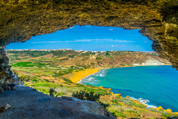 Aerial view of Ir-Ramla bay at Gozo through Tal-Mixta Cave, Malta - obrazy, fototapety, plakaty
