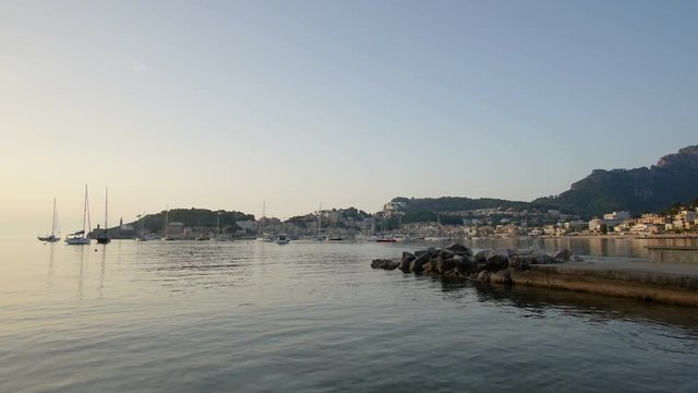 4k time lapse of sunset over the Mediterranean Sea at Port de Soller on the coast of Mallorca