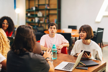 Group of young workers meeting at modern office.