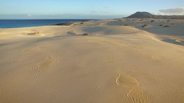 Aerial view of cars on the road of Corralejo Dunes Natural Park in Fuerteventura