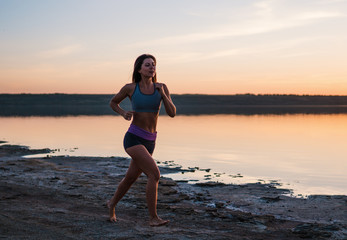 Woman Running on the Beach at Sunset.