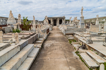 Obraz premium Tombs at Cementerio la Reina cemetery in Cienfuegos, Cuba. The cemtery was damaged by a hurricane.