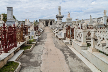 Obraz premium Tombs at Cementerio la Reina cemetery in Cienfuegos, Cuba. The cemtery was damaged by a hurricane.