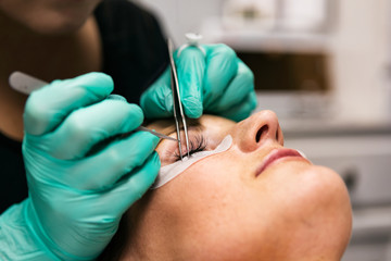Spa: Aesthetician Applies Eyelash Extensions To Patient