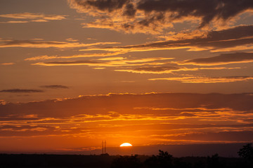 Golden color of dramatic clouds and sky on sunset