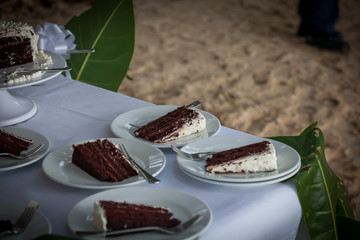 The wedding cake is cut  in wedding ceremony.

