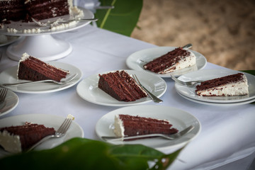 The wedding cake is cut  in wedding ceremony.

