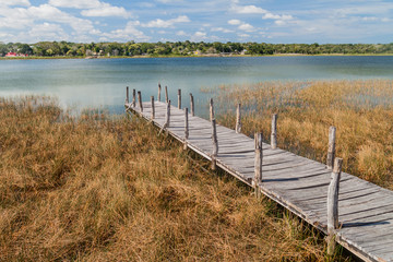 Wooden pier at Laguna Coba lake near Mayan ruins of Coba, Mexico