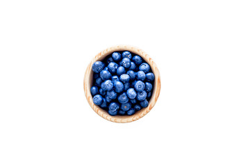 Fresh recently picked blueberries in bowl on white background top view copy space