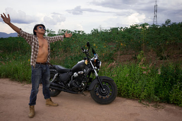 Fototapeta na wymiar Men riding a motorcycle in the countryside 