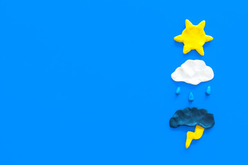 Modern weather icons set on blue background top view copy space