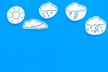 Modern weather icons set on blue background top view copy space
