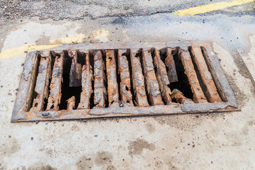 Rusty dangerous manhole cover