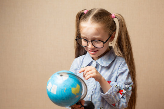 Little Girl With Globe. Education Concept