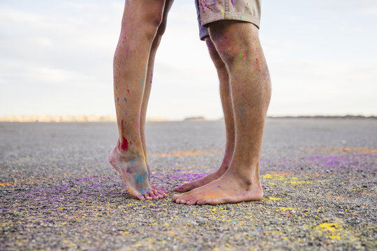 Legs dirty with colored powder
