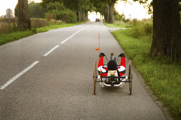 Sportive man riding on handcycle