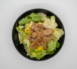 Homemade grilled pork with organic green vegetable isolated on white