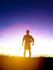 Foto op Plexiglas rear view soccer football player watching the sunrise © Tom Wang