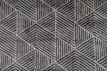 Black and grey carpet with hand made geometric pattern