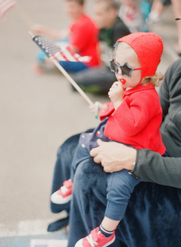 baby girl at fourth of july parade